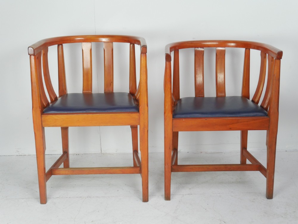 A pair of warm wood Arts and Crafts tub chairs with curved slat backs and blue upholstered seats. View XIII