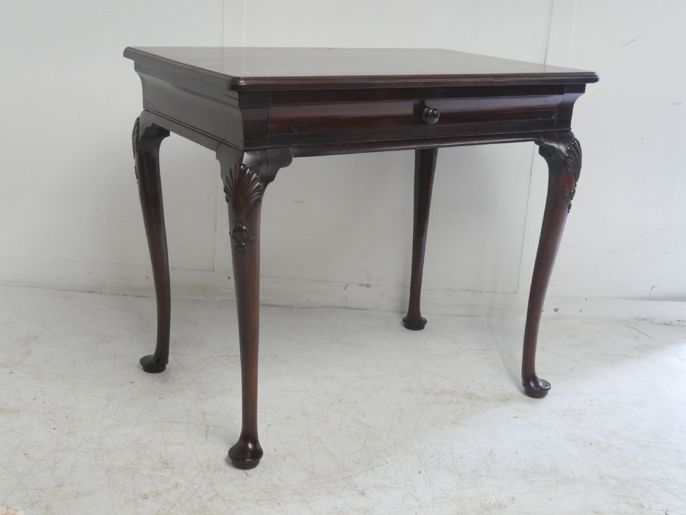 A 19th-century dark mahogany side table featuring a single frieze drawer, carved shell motifs on cabriole legs, and pad feet. View XII