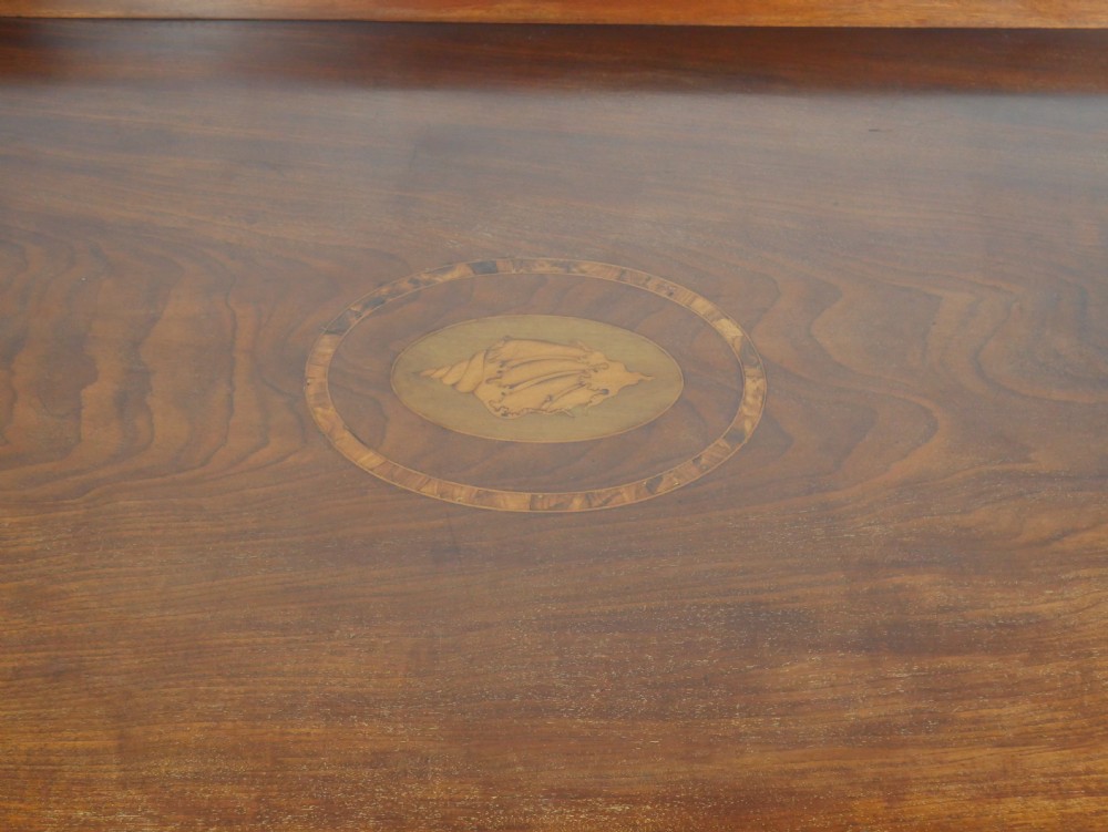A Georgian bow-front mahogany sideboard featuring satinwood inlays, brass oval handles, and square tapered legs. View XVIII