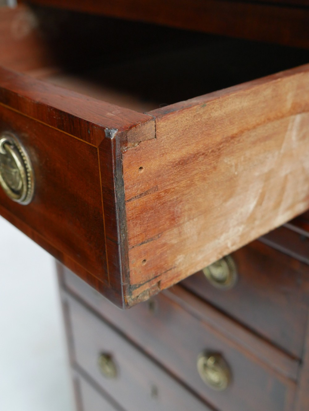 A 19th-century mahogany kneehole partners desk featuring twin pedestals, multiple drawers with brass drop handles, and a flat rectangular writing top. View XVIII