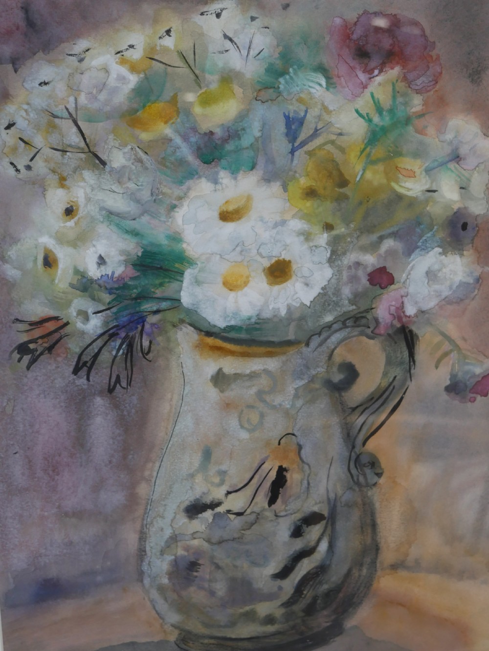 A framed watercolour painting depicting white and yellow flowers in a decorative cream jug, signed Margaret Laing and dated 1954. View II