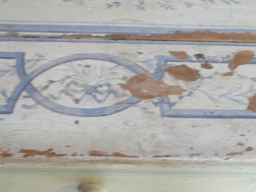A 19th-century cream-painted wooden writing desk featuring five drawers, turned legs with stretchers, and a low gallery back decorated with light blue geometric painted borders. View VIII