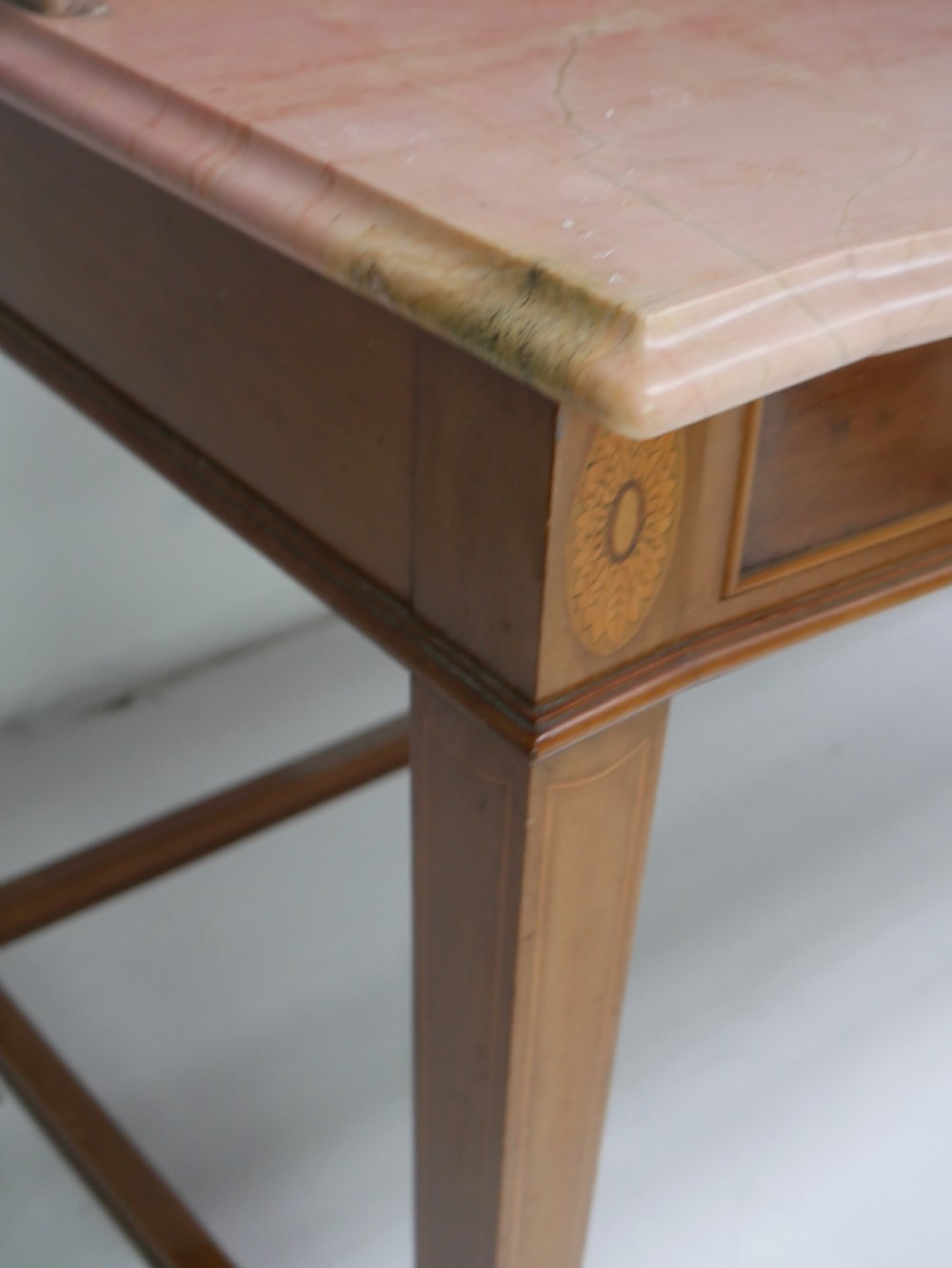 A mahogany writing table featuring two inlaid drawers, square tapered legs, and a pink marble top with a raised gallery back. View XI