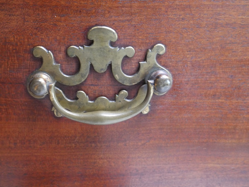 An eighteenth-century Georgian dark mahogany secretaire tallboy featuring two stacked chest sections, brass handles, and bracket feet. View VIII