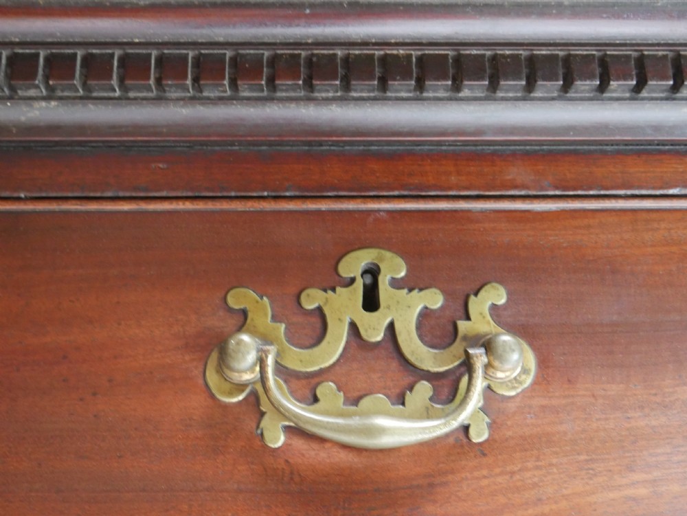 An eighteenth-century Georgian dark mahogany secretaire tallboy featuring two stacked chest sections, brass handles, and bracket feet. View IX