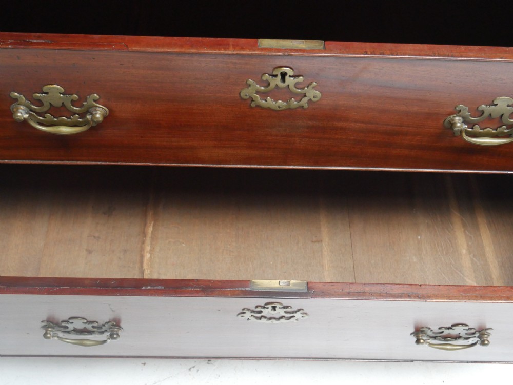 An eighteenth-century Georgian dark mahogany secretaire tallboy featuring two stacked chest sections, brass handles, and bracket feet. View XVI