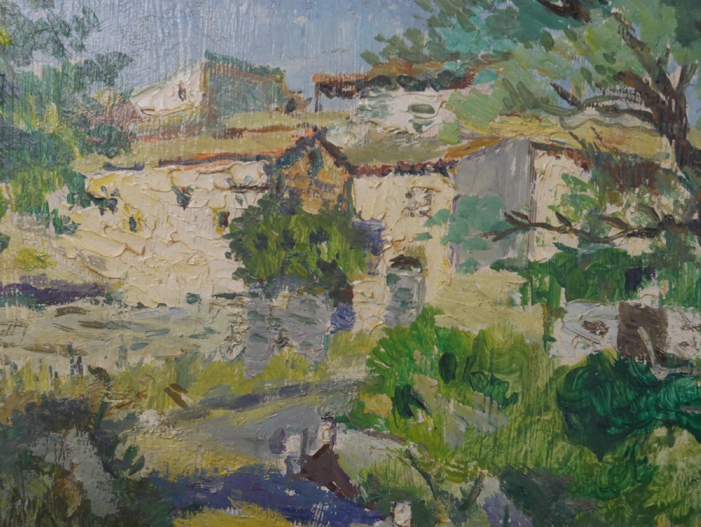 An impressionist oil painting depicting a sunny French village landscape with stone buildings and trees, presented in a dark wooden frame. View II