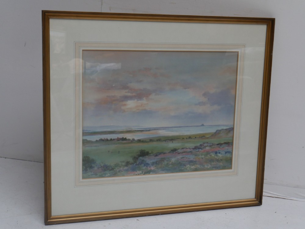 A framed mid-20th-century watercolour painting depicting an expansive coastal landscape under a soft sky, contained within a gilt wooden frame. View IV