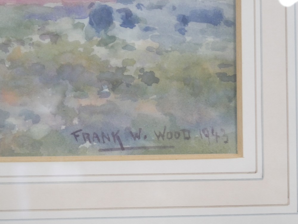 A framed mid-20th-century watercolour painting depicting an expansive coastal landscape under a soft sky, contained within a gilt wooden frame. View II
