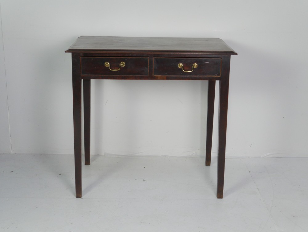 A dark mahogany Georgian side table featuring two front drawers with brass swan-neck handles and square tapered legs. View II