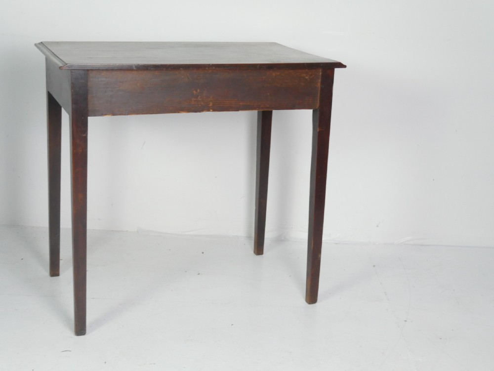 A dark mahogany Georgian side table featuring two front drawers with brass swan-neck handles and square tapered legs. View X