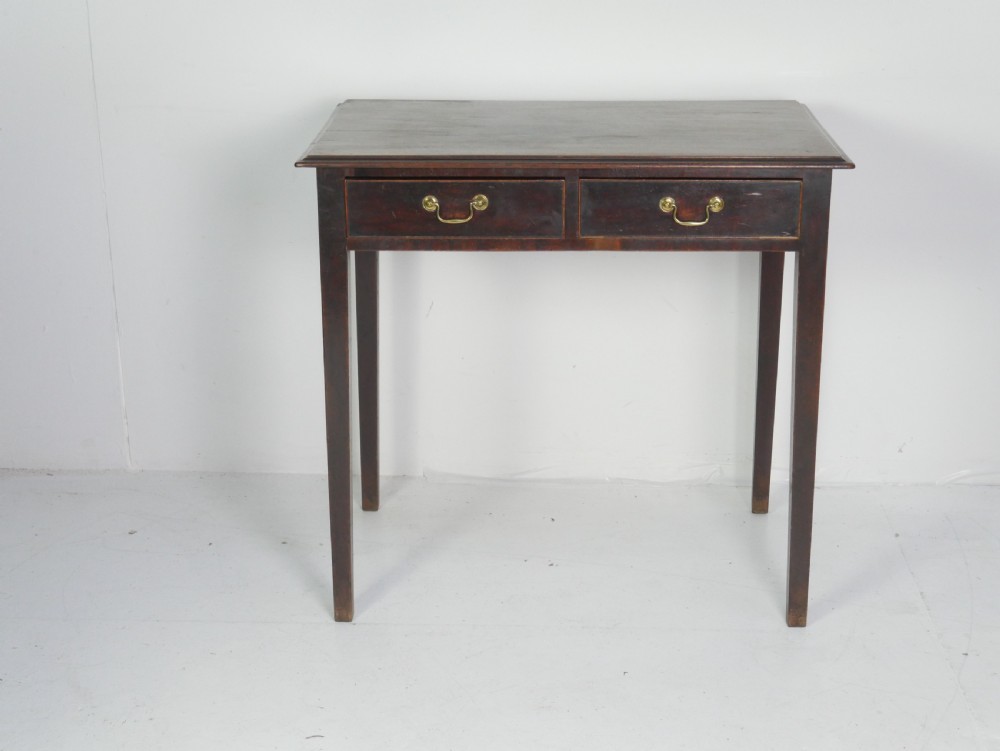 A dark mahogany Georgian side table featuring two front drawers with brass swan-neck handles and square tapered legs. View XI