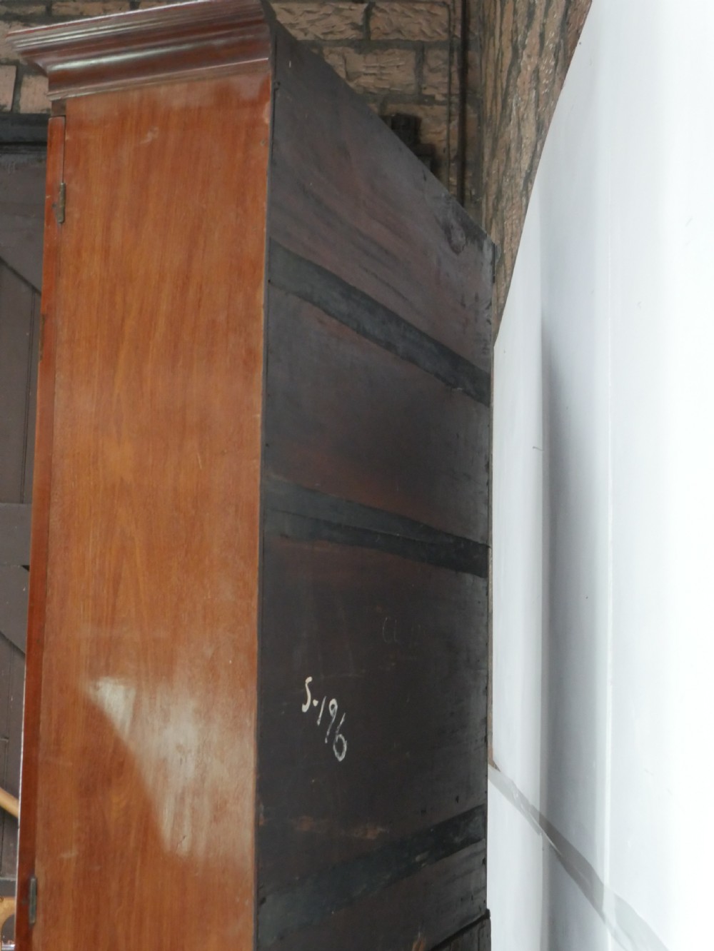 A tall Georgian mahogany bureau bookcase featuring a swan-neck pediment, glazed upper doors, a slant-front writing slope, four long drawers, and bracket feet. View VIII