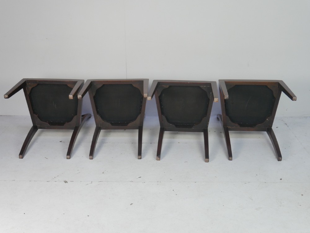A set of six antique Georgian mahogany dining chairs with reeded vertical bar backs and embroidered needlepoint drop-in seats. View X