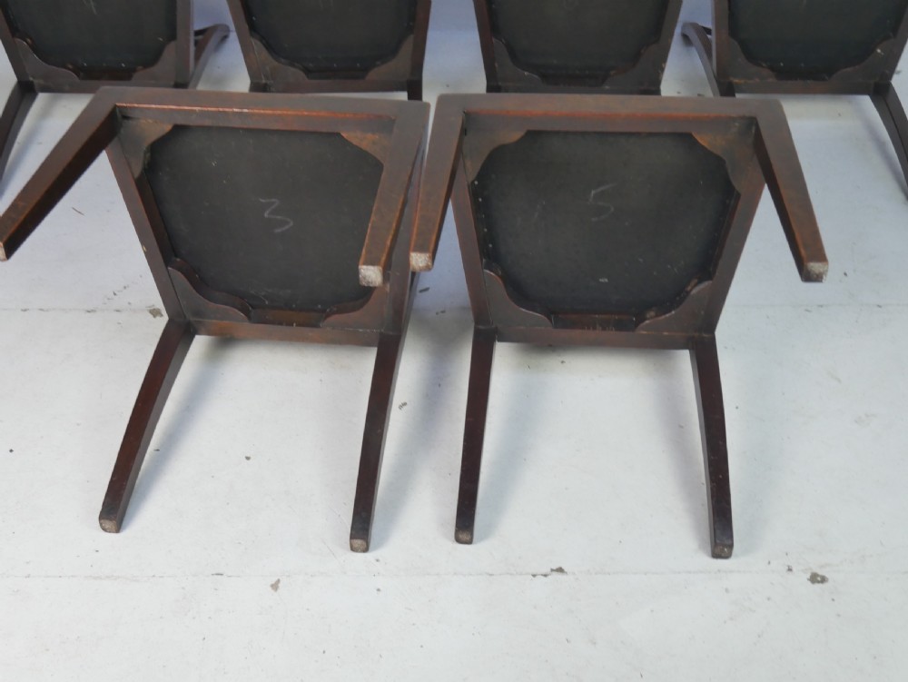 A set of six antique Georgian mahogany dining chairs with reeded vertical bar backs and embroidered needlepoint drop-in seats. View XI