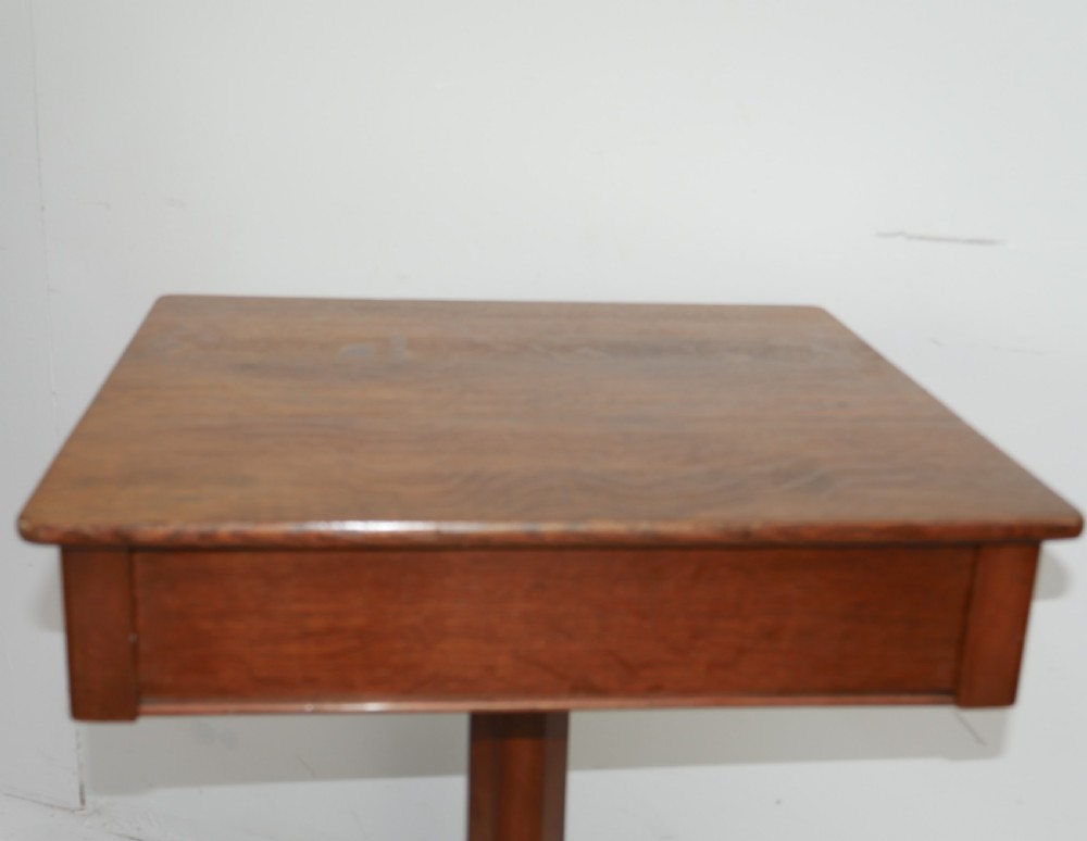 A square-topped antique oak side table featuring a central column support resting on a curved four-legged pedestal base. View II