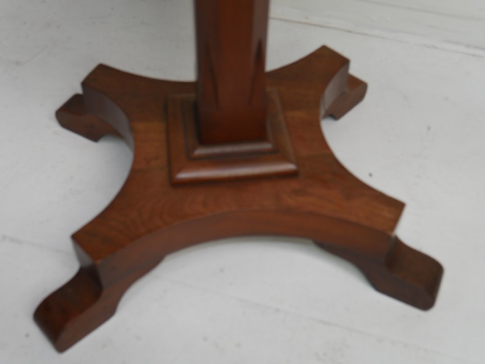 A square-topped antique oak side table featuring a central column support resting on a curved four-legged pedestal base. View VIII