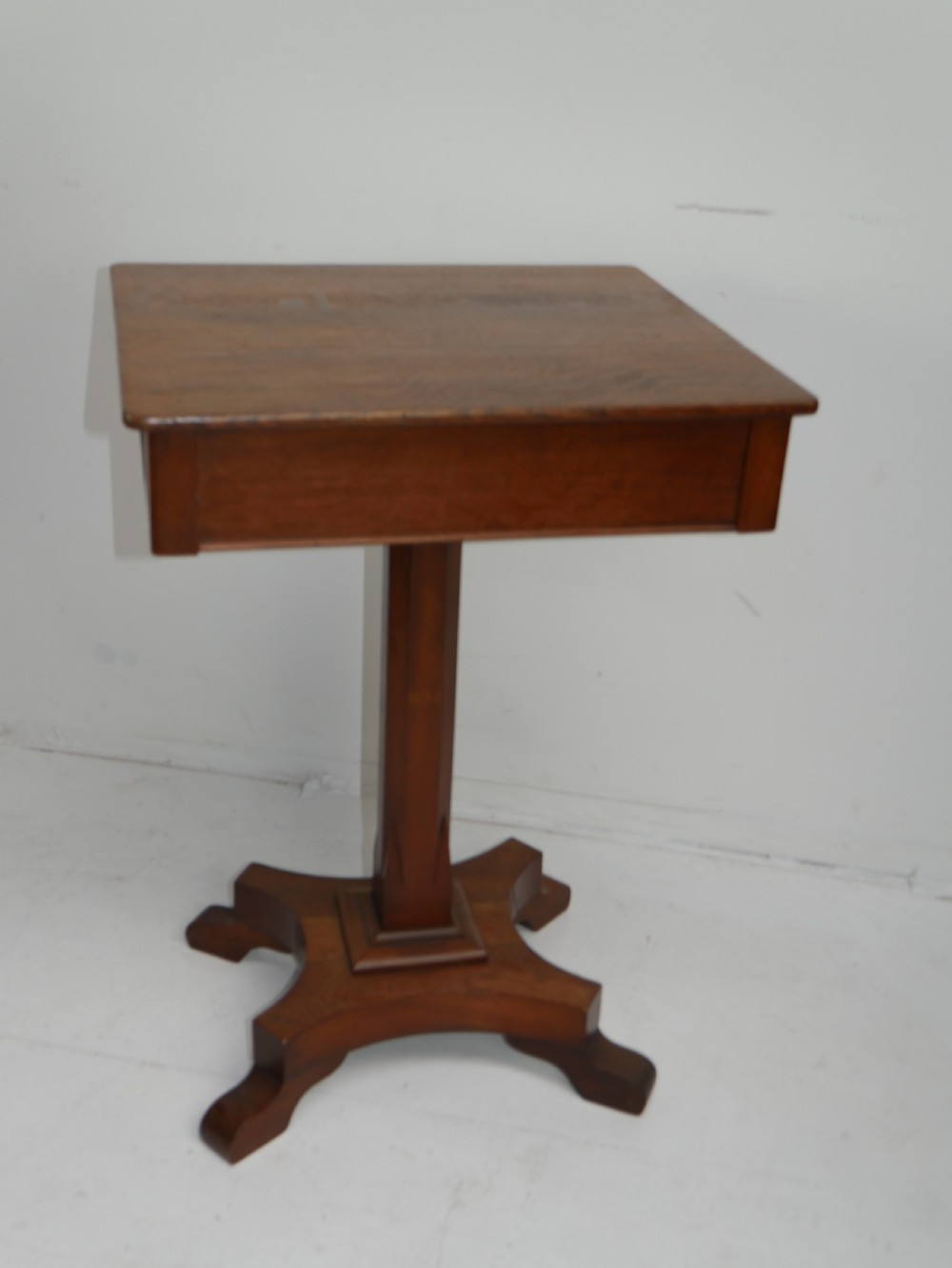 A square-topped antique oak side table featuring a central column support resting on a curved four-legged pedestal base. View IX