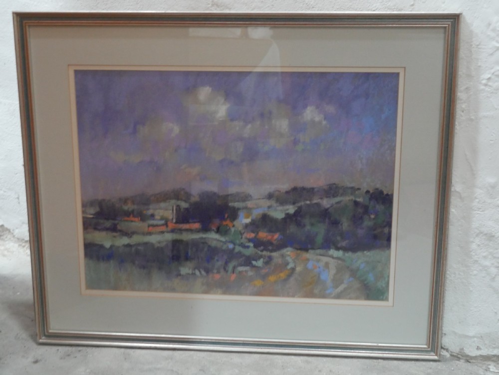 A framed landscape painting depicting rolling Norfolk fields under a muted purple sky, presented in a grey double mount and silver-toned frame.