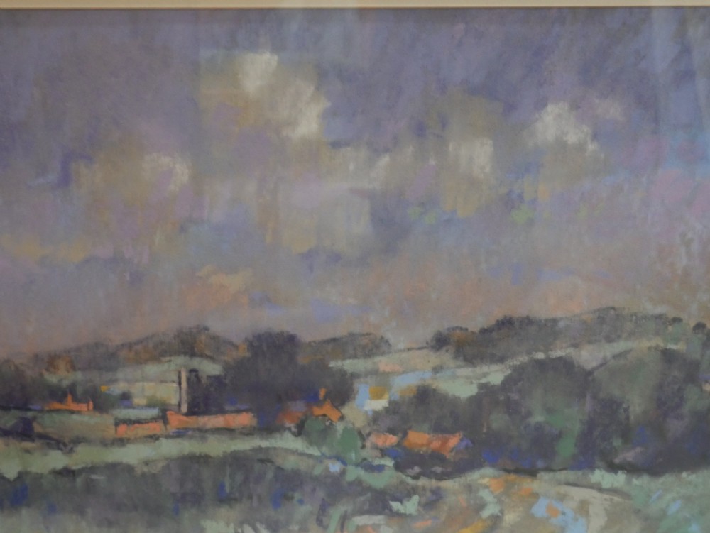 A framed landscape painting depicting rolling Norfolk fields under a muted purple sky, presented in a grey double mount and silver-toned frame. View II