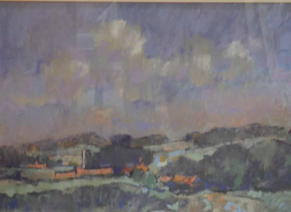 A framed landscape painting depicting rolling Norfolk fields under a muted purple sky, presented in a grey double mount and silver-toned frame. View V