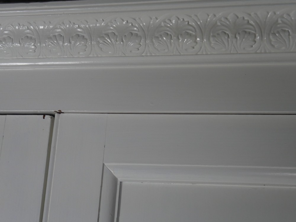 A large double-door white painted wooden wardrobe with open doors revealing a natural pine interior featuring a hanging rail and top shelf. View XIII