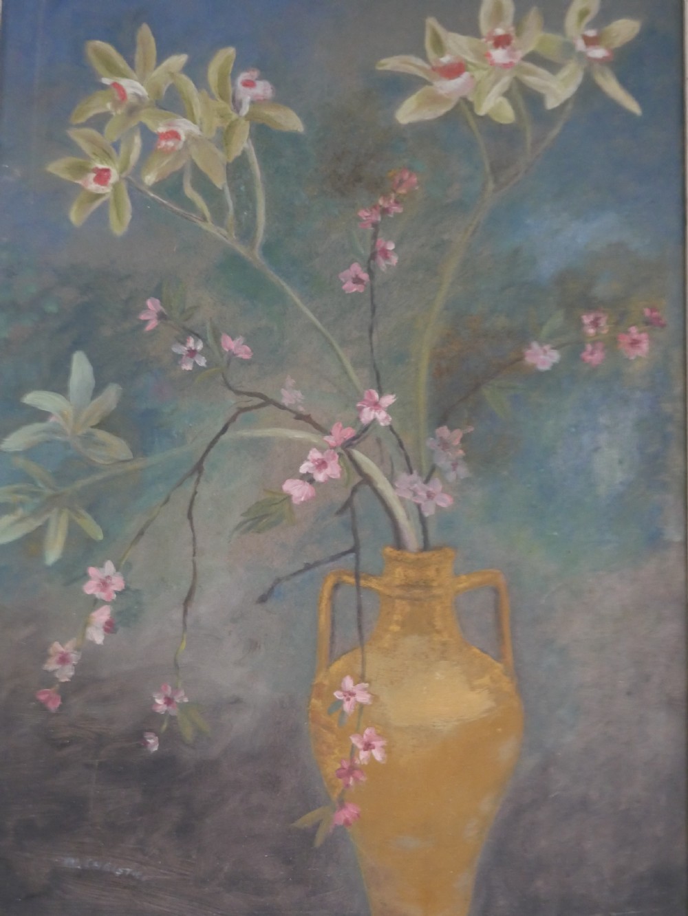A 1960s framed floral still life painting depicting green orchids and pink blossoms in a yellow two-handled vase against a dark blue background. View II