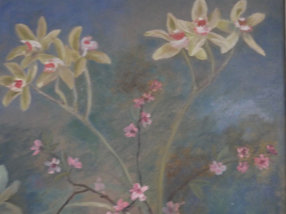 A 1960s framed floral still life painting depicting green orchids and pink blossoms in a yellow two-handled vase against a dark blue background. View V
