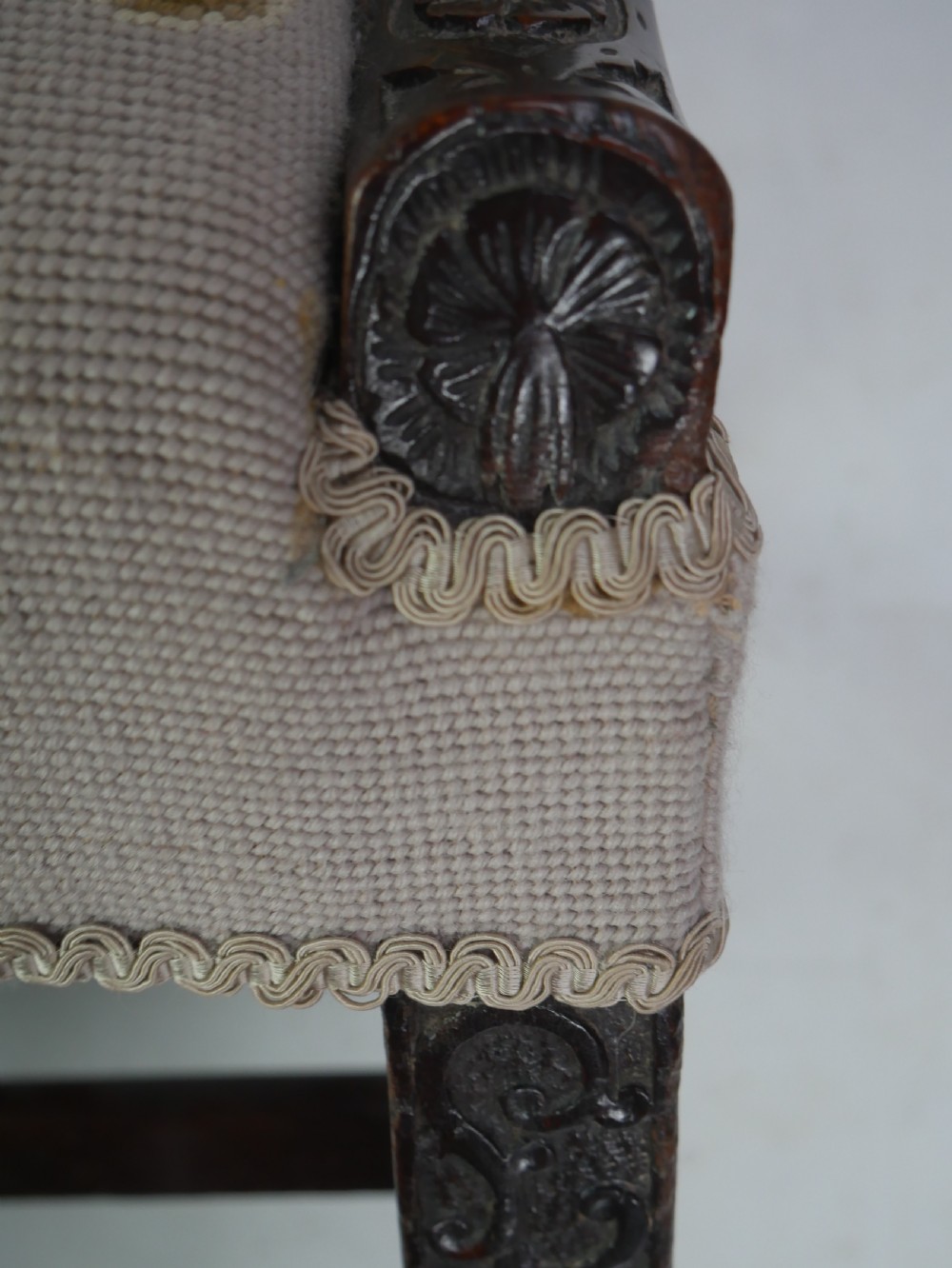 A Georgian Gainsborough armchair with dark carved mahogany legs, upholstered in beige needlepoint tapestry featuring a central pastoral scene and floral borders. View VIII