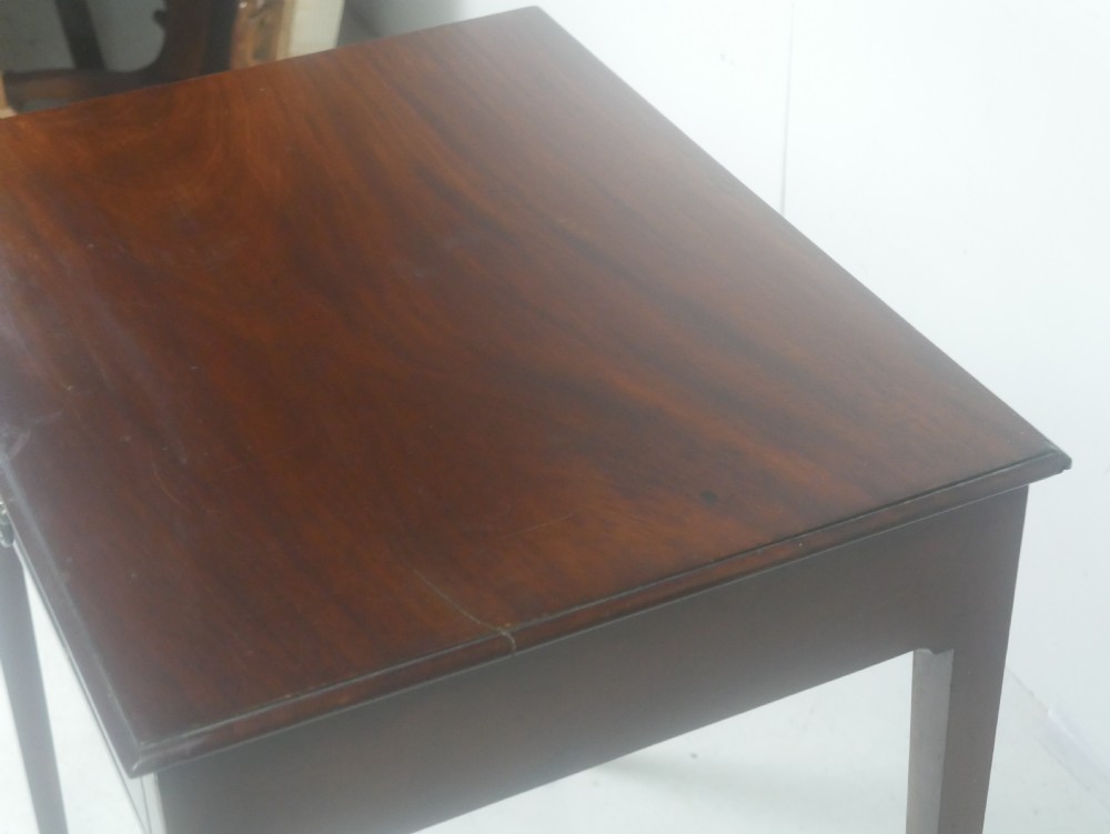 A rectangular mahogany lamp table with straight tapered legs and a single drawer featuring a brass drop handle. View II