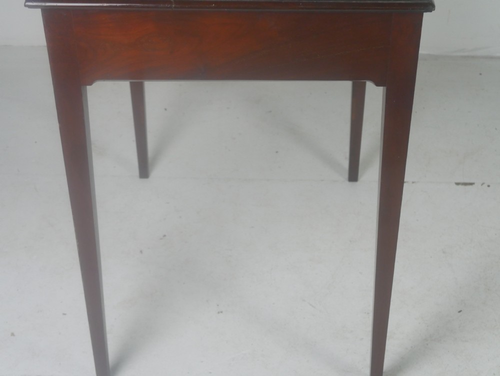 A rectangular mahogany lamp table with straight tapered legs and a single drawer featuring a brass drop handle. View V