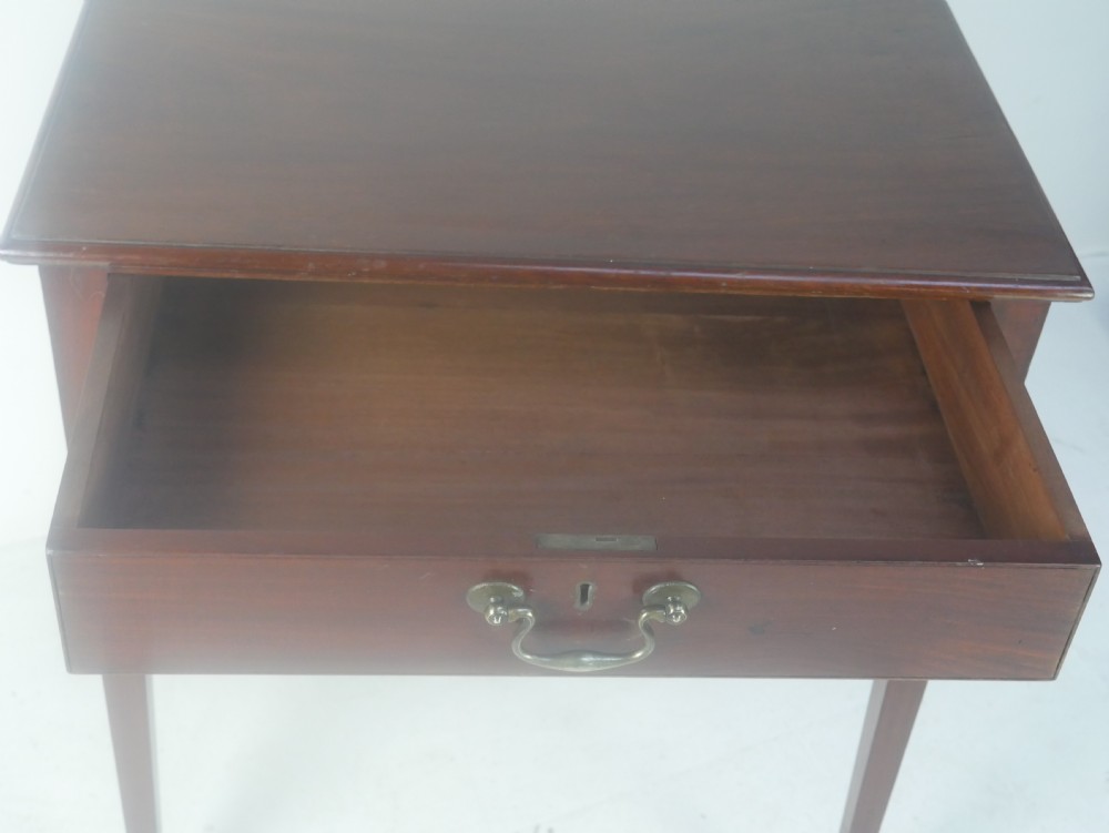 A rectangular mahogany lamp table with straight tapered legs and a single drawer featuring a brass drop handle. View IX
