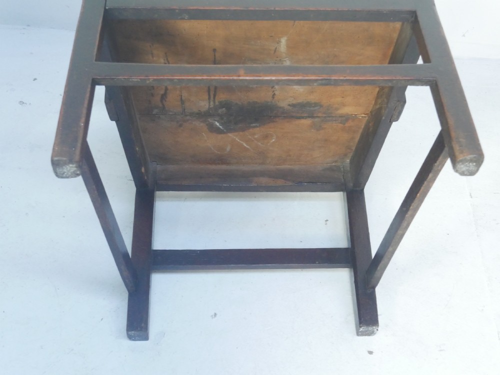 A dark wood Georgian country armchair featuring a pierced back splat with a heart motif, solid seat, curved armrests, and a sturdy stretcher base. View VIII