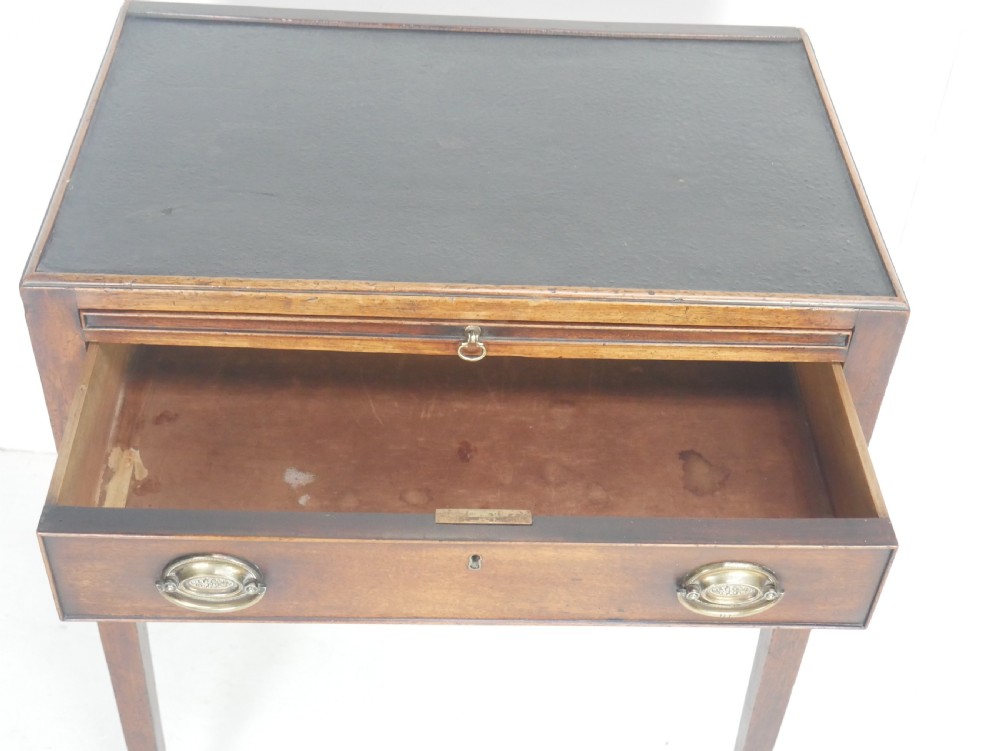A Georgian mahogany side table featuring a dark leather inset top, frieze drawer with brass handles, and slender tapered legs. View IV