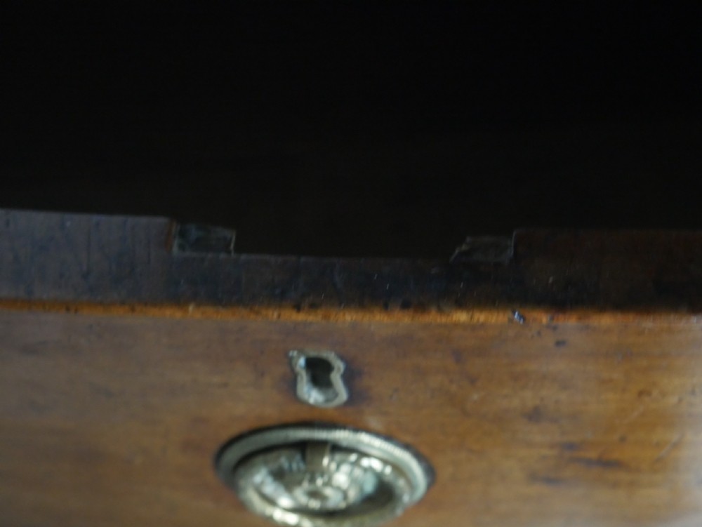 A Georgian mahogany bow-front chest of drawers featuring two short drawers over three long graduated drawers with circular brass drop handles. View VI