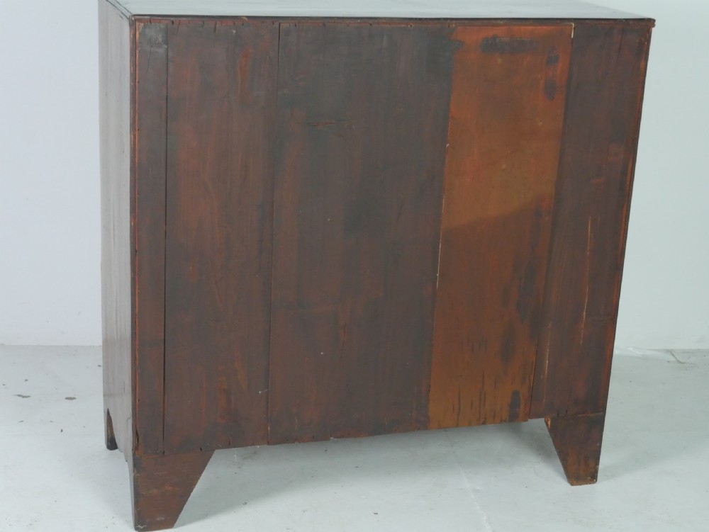 A Georgian mahogany bow-front chest of drawers featuring two short drawers over three long graduated drawers with circular brass drop handles. View VII