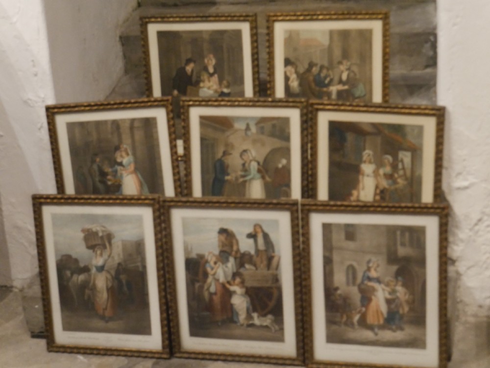 A set of eight matching framed coloured prints depicting traditional English street traders housed in gold gilt frames. View III