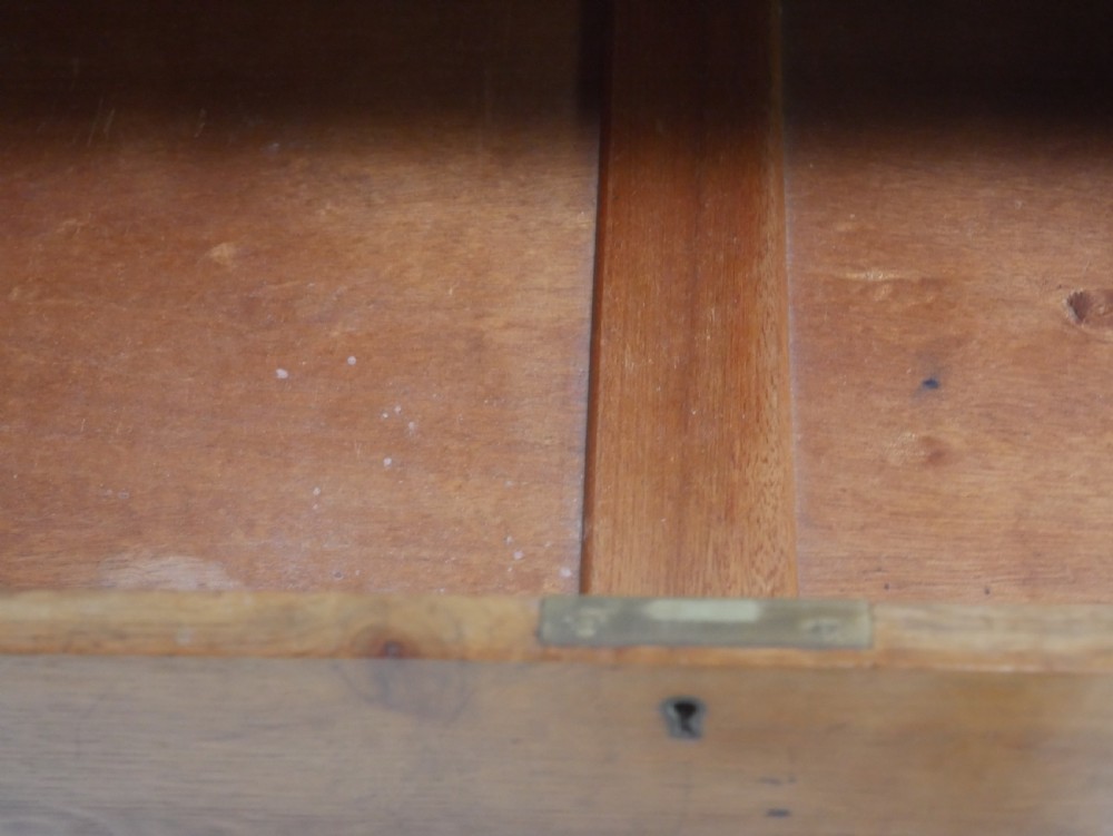 A mid-20th-century golden oak chest of drawers featuring three full-width drawers with contrasting dark wooden block handles and a low rear gallery rail. View VIII
