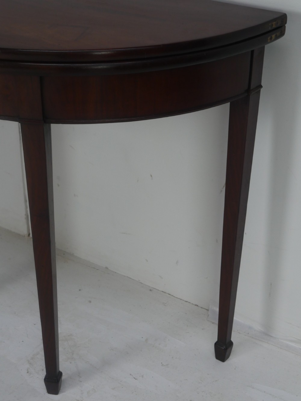 A Georgian mahogany demi-lune side table featuring a semi-circular top and four slender square tapered legs. View III