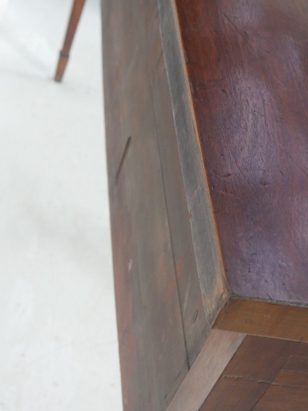A Georgian mahogany bow-front sideboard featuring a central arch aperture, multiple drawers with oval brass handles, and square tapered legs. View X