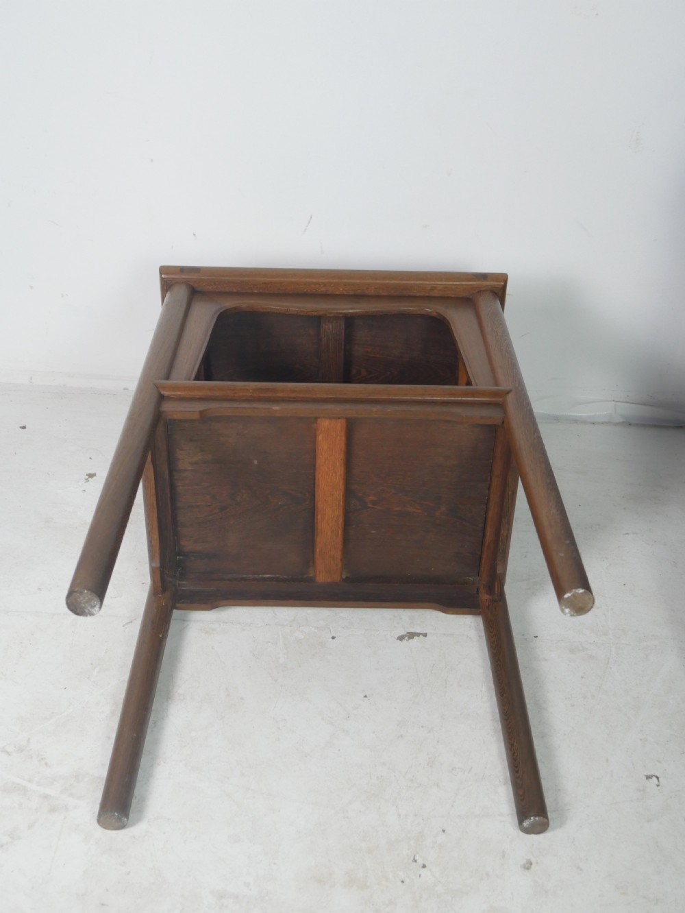 A warm brown oak side table featuring an upper rectangular top, arched aprons, a lower storage shelf, and straight legs. View VIII