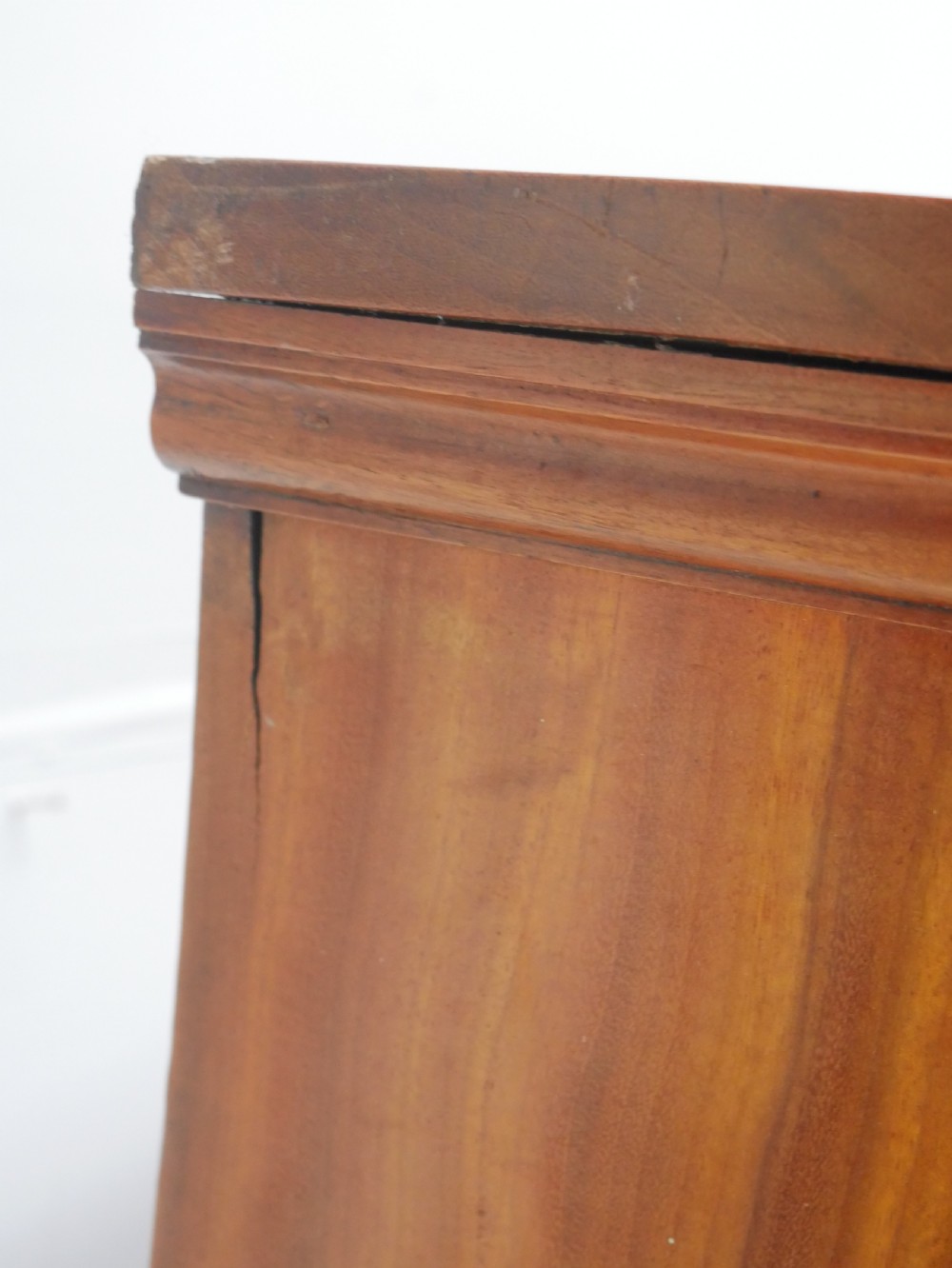 A 19th-century warm brown wooden tallboy chest featuring two short drawers over three long drawers with intricate carved foliate handles. View XIV