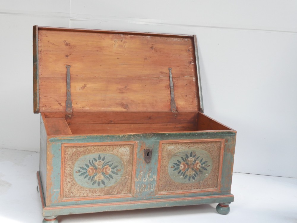 A 19th-century Swedish painted wooden coffer chest featuring green paint, oval floral medallions, moulded framing, and hand-painted initials dated 1810. View II
