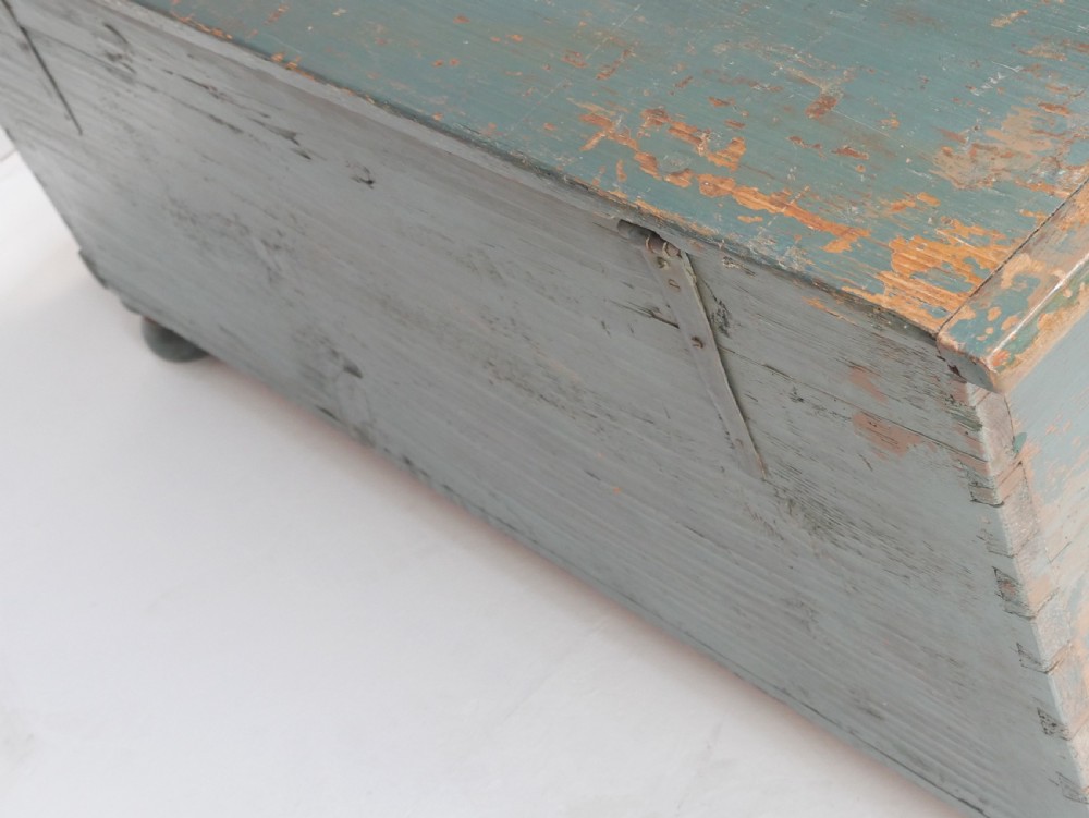 A 19th-century Swedish painted wooden coffer chest featuring green paint, oval floral medallions, moulded framing, and hand-painted initials dated 1810. View V
