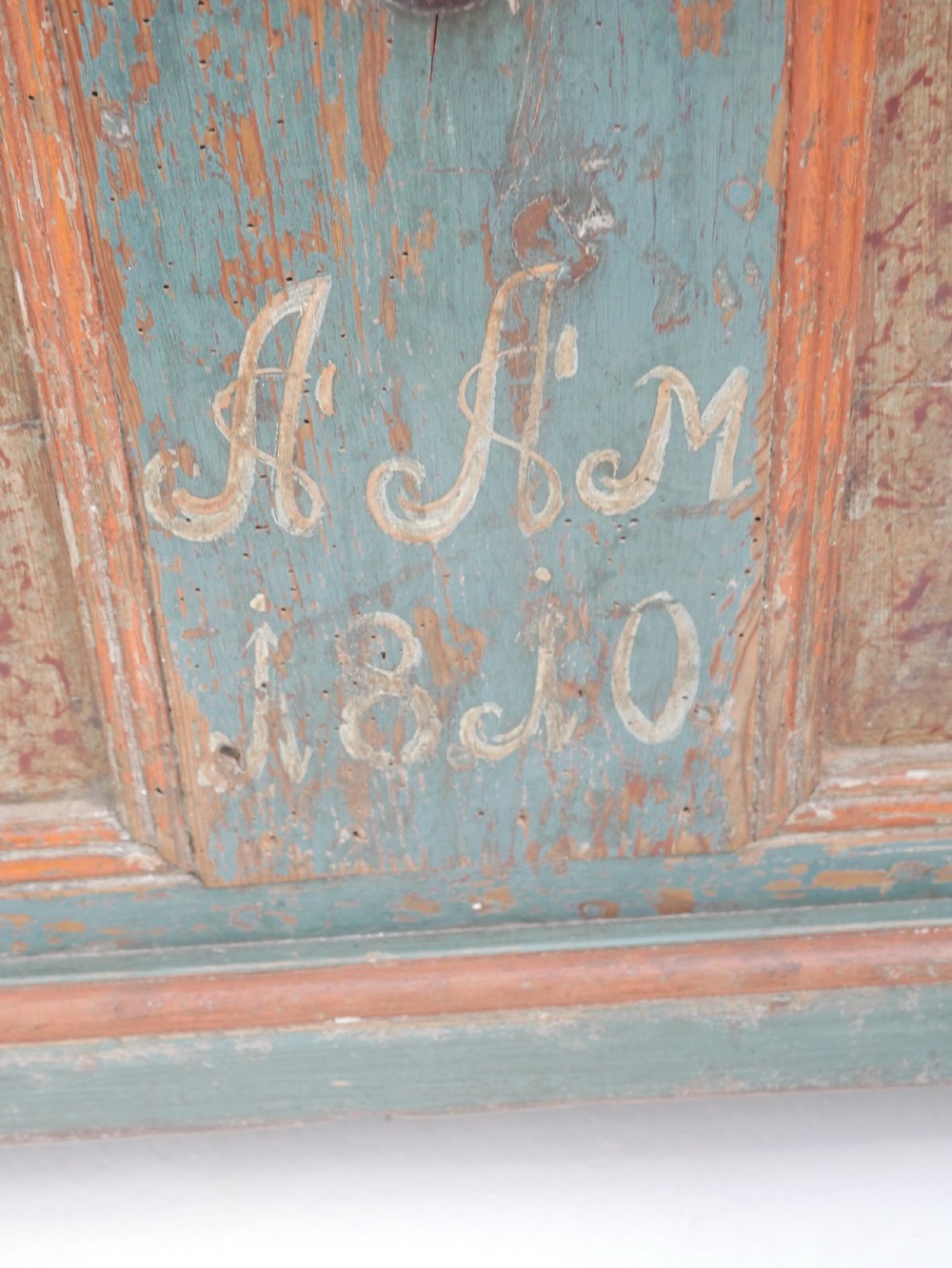A 19th-century Swedish painted wooden coffer chest featuring green paint, oval floral medallions, moulded framing, and hand-painted initials dated 1810. View VII