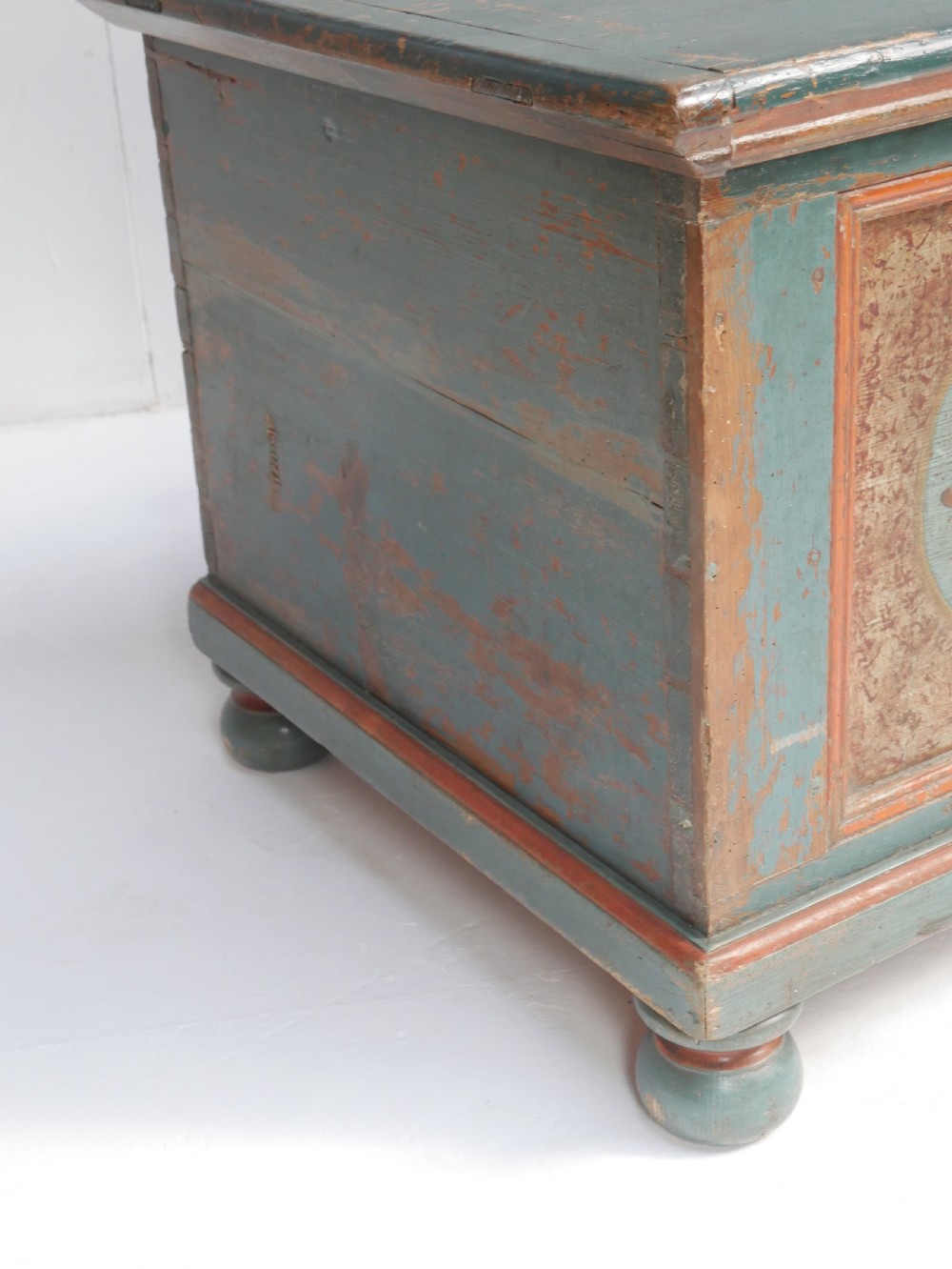 A 19th-century Swedish painted wooden coffer chest featuring green paint, oval floral medallions, moulded framing, and hand-painted initials dated 1810. View XII
