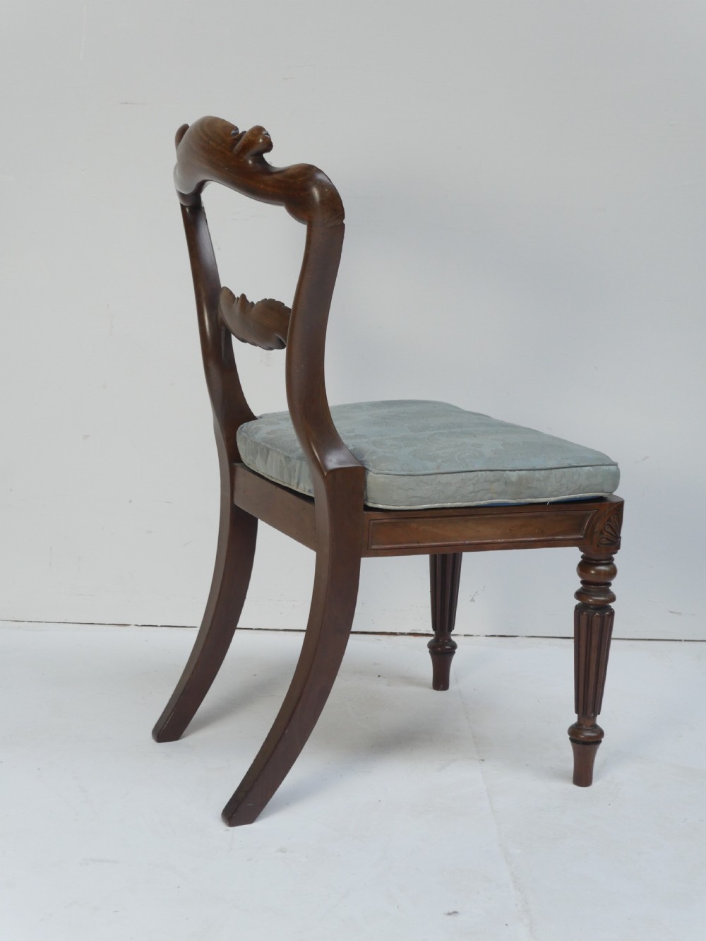 Pair of Regency mahogany side chairs with blue fabric seats and turned reeded legs. View III