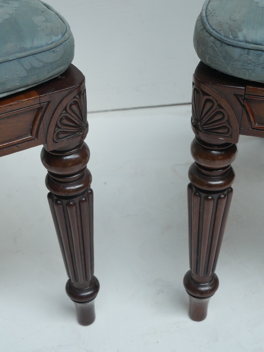 Pair of Regency mahogany side chairs with blue fabric seats and turned reeded legs. View VI