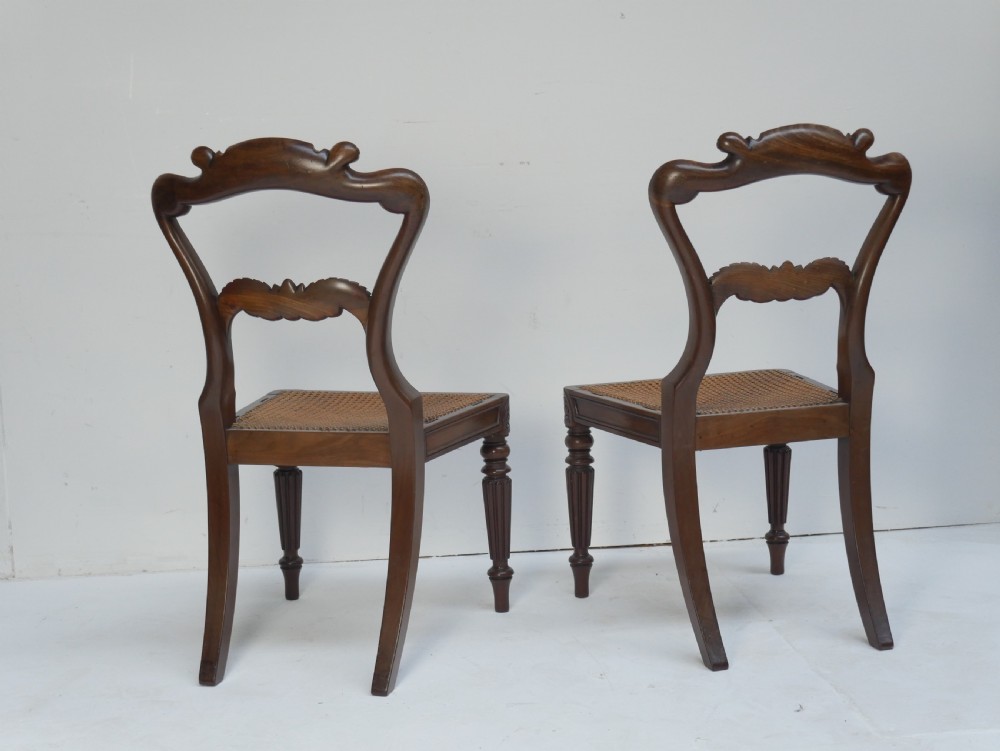 Pair of Regency mahogany side chairs with blue fabric seats and turned reeded legs. View X