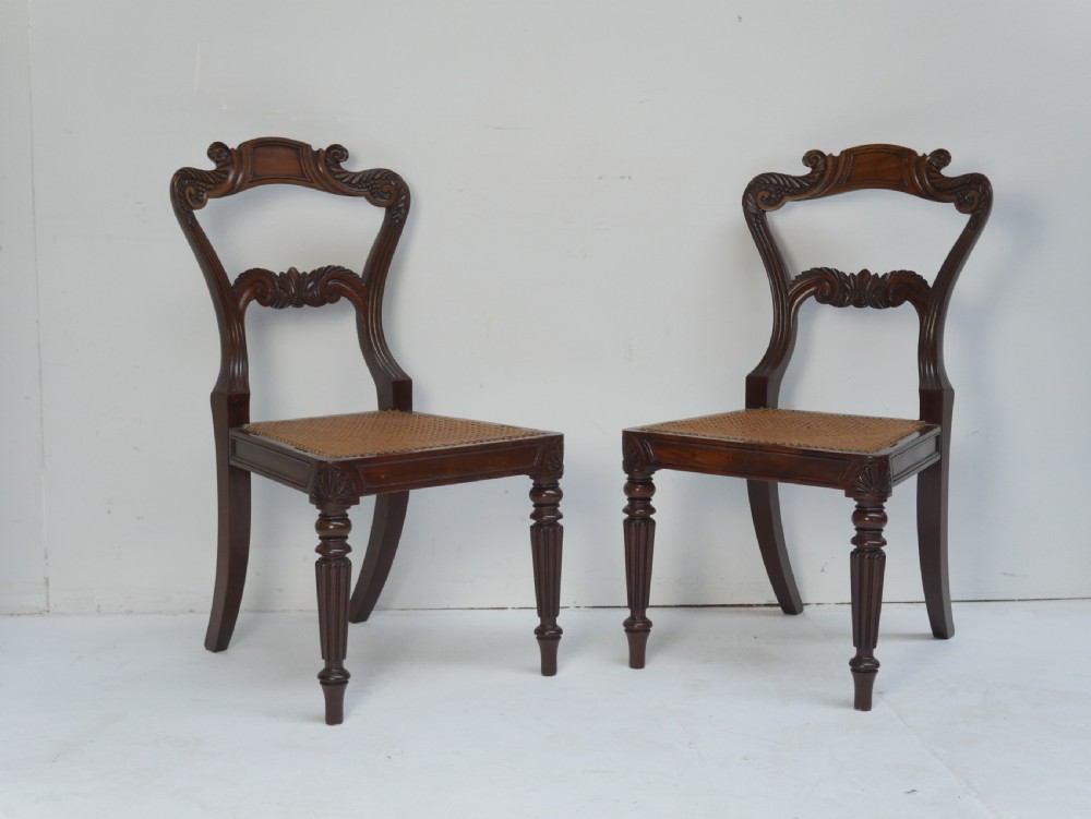 Pair of Regency mahogany side chairs with blue fabric seats and turned reeded legs. View XI